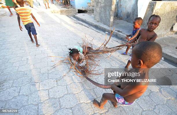 Children play in Cite Soleil, the biggest slum in Port-Au-Prince April 28 ,2010. Orphans from the January 12, 2010 earthquake that left...