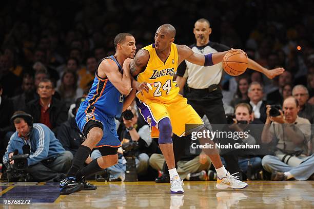 Kobe Bryant of the Los Angeles Lakers posts up against Thabo Sefolosha of the Oklahoma City Thunder in Game Five of the Western Conference...