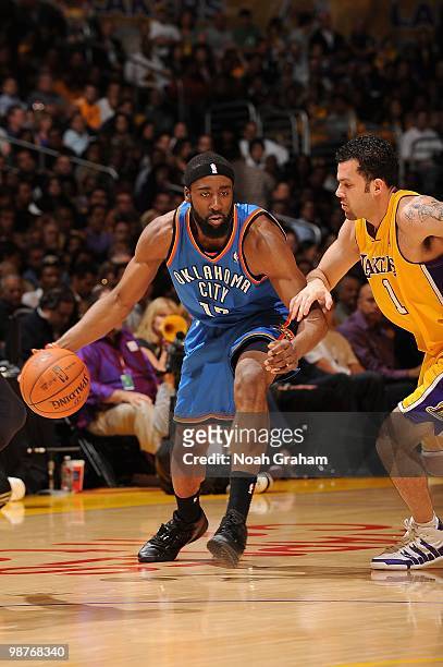 James Harden of the Oklahoma City Thunder handles the ball against Jordan Farmar of the Los Angeles Lakers in Game Five of the Western Conference...