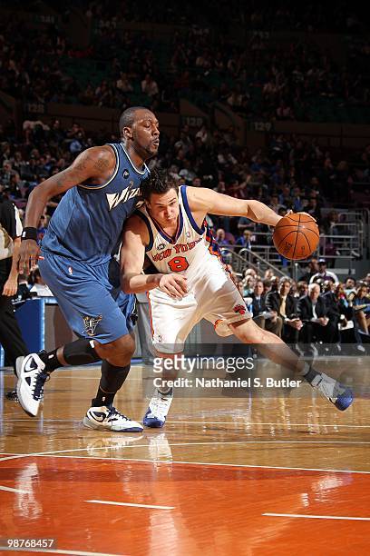 Danilo Gallinari of the New York Knicks drives the ball against Andray Blatche of the Washington Wizards during the game at Madison Square Garden on...
