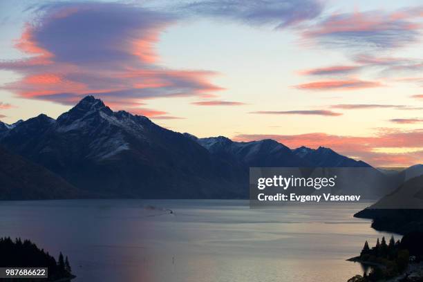 sunrise over walter peak and lake wakitipu in queenstown, new zealand. - walter peak stock pictures, royalty-free photos & images