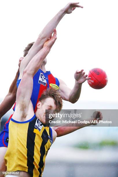 Ben Paton of Sandringham competes for the ball during the round 13 VFL match between Port Melbourne and Sandringham at North Port Oval on June 30,...