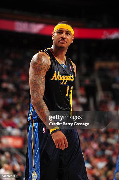 Carmelo Anthony of the Denver Nuggets looks on during the game against the Phoenix Suns at U.S. Airways Center on April 13, 2010 in Phoenix, Arizona....