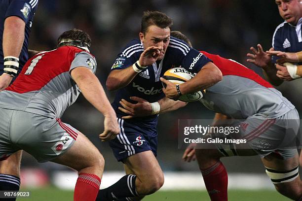 Stormers scrumhalf Dewaldt Duvenage attempts break through Crusaders lock Chris Jack's tackle as Crusaders prop Wyatt Crockett moves in, during the...