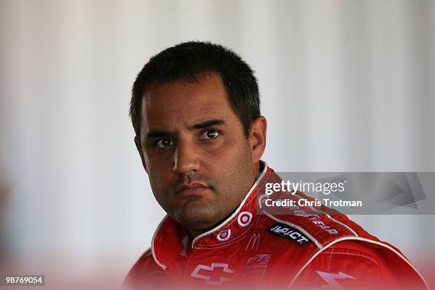 Juan Pablo Montoya. Driver of the Target Chevrolet stands in the garage during practice for the Crown Royal Presents The Heath Calhoun 400 at...