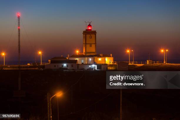 night shot of cape carvoeiro lighthouse in peniche, portugal - peniche stock pictures, royalty-free photos & images