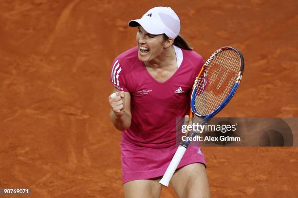 Justine Henin of Belgium celebrates after winning the second sentence during her quarter final match against Jelena Jankovic of Serbia at day five of...