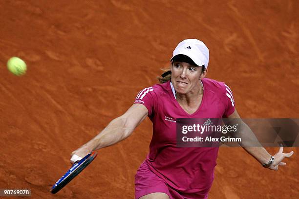 Justine Henin of Belgium plays a backhand during her quarter final match against Jelena Jankovic of Serbia at day five of the WTA Porsche Tennis...