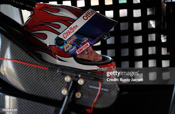 Tony Stewart, driver of the Office Depot/Old Spice Chevrolet, sits in his car uring practice at Richmond International Raceway on April 30, 2010 in...