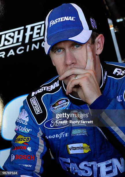 Carl Edwards, driver of the Scotts EZ Seed Ford looks on in the garage during practice for the CROWN ROYAL Presents the Heath Calhoun 400 at Richmond...
