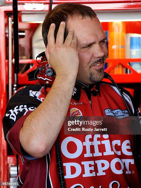 Darian Grubb, crew chief for the Office Depot/Old Spice Chevrolet driven by Tony Stewart reacts in the garage during practice for the CROWN ROYAL...