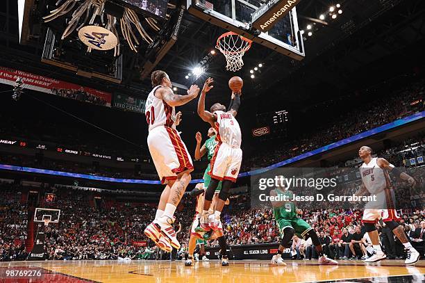 Dwyane Wade of the Miami Heat rebounds against the Boston Celtics in Game Four of the Eastern Conference Quarterfinals during the 2010 NBA Playoffs...