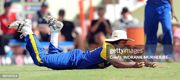 Sri Lankan cricketer Lasith Malinga dives to take the catch of Brendon McCullam of New Zealand saves a shot by during their ICC World Twenty20 2010...