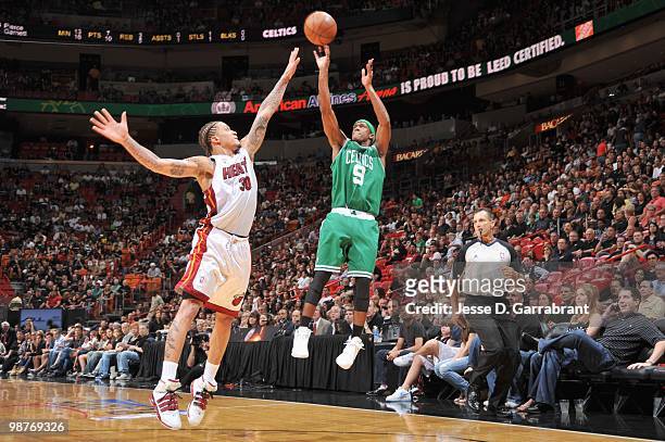 Rajon Rondo of the Boston Celtics makes a jumpshot against Michael Beasley of the Miami Heat in Game Four of the Eastern Conference Quarterfinals...