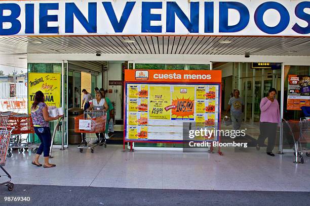 Customers enter and exit a Chedraui grocery store in Mexico City, Mexico, on Friday, April 30, 2010. Mexican retailer Grupo Comercial Chedraui SAB...