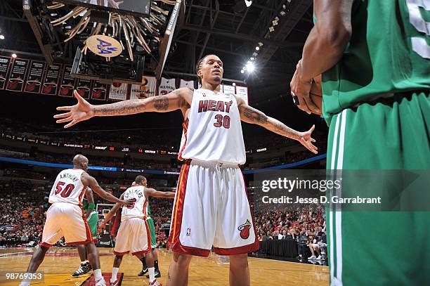 Michael Beasley of the Miami Heat guards against Boston Celtics in Game Four of the Eastern Conference Quarterfinals during the 2010 NBA Playoffs at...