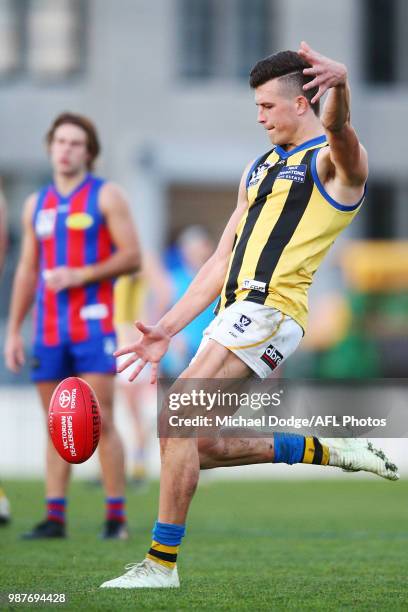 Rowan Marshall of Sandringham kicks the ball during the round 13 VFL match between Port Melbourne and Sandringham at North Port Oval on June 30, 2018...