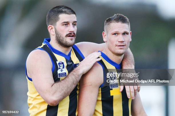 Josh Bruce and Sam Gilbert of Sandringham celebrate the win during the round 13 VFL match between Port Melbourne and Sandringham at North Port Oval...