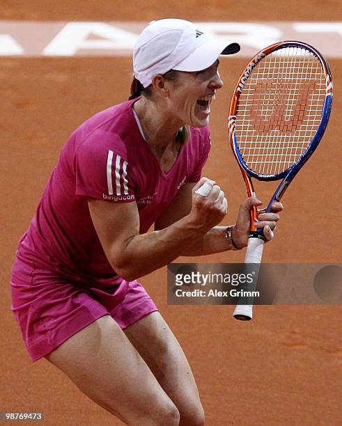 Justine Henin of Belgium celebrates after winning her quarter final match against Jelena Jankovic of Serbia at day five of the WTA Porsche Tennis...
