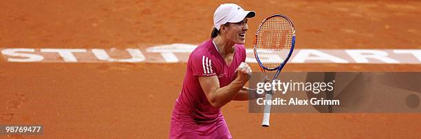 Justine Henin of Belgium celebrates after winning her quarter final match against Jelena Jankovic of Serbia at day five of the WTA Porsche Tennis...