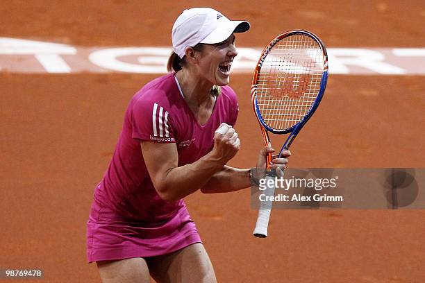 Justine Henin of Belgium celebrates after winning her quarter final match against Jelena Jankovic of Serbia at day five of the WTA Porsche Tennis...