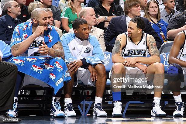 Carlos Boozer, Ronnie Price and Deron Williams of the Utah Jazz smile on the bench in Game Three of the Western Conference Quarterfinals against the...