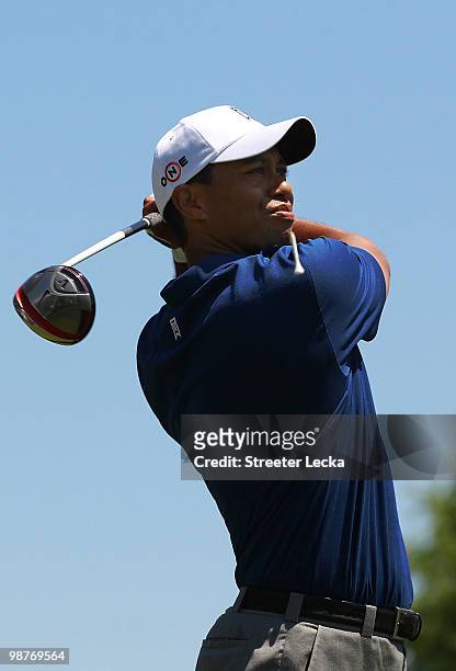 Tiger Woods hits his tee shot on the 1st hole during the second round of the Quail Hollow Championship at Quail Hollow Country Club on April 30, 2010...