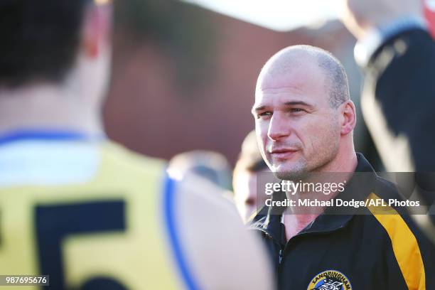 Sandringham coach Aaron Hamill speaks to his players during the round 13 VFL match between Port Melbourne and Sandringham at North Port Oval on June...