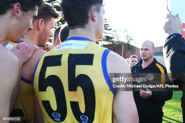 Sandringham coach Aaron Hamill speaks to his players during the round 13 VFL match between Port Melbourne and Sandringham at North Port Oval on June...