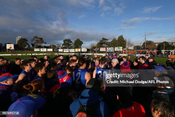 Port Melbourne coach Gary Ayres speaks to his players during the round 13 VFL match between Port Melbourne and Sandringham at North Port Oval on June...