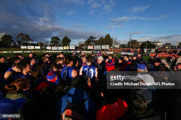 Port Melbourne coach Gary Ayres speaks to his players during the round 13 VFL match between Port Melbourne and Sandringham at North Port Oval on June...