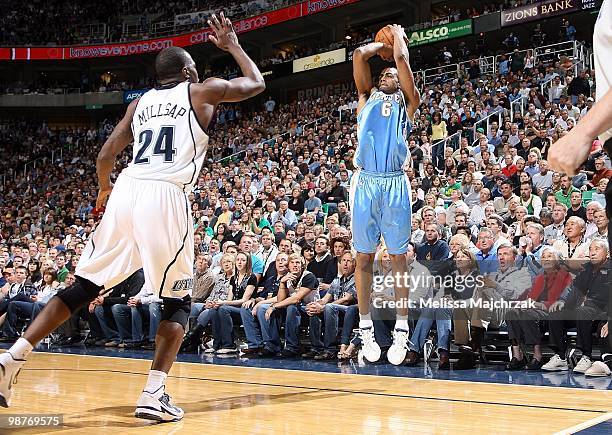 Arron Afflalo of the Denver Nuggets shoots against Paul Millsap of the Utah Jazz in Game Three of the Western Conference Quarterfinals during the...