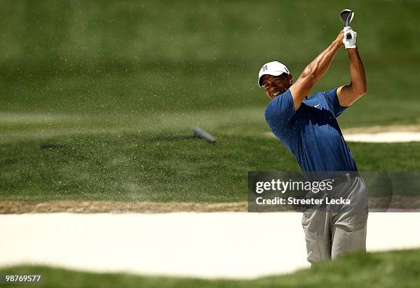 Tiger Woods hits a shot from the sand on the 7th hole during the second round of the Quail Hollow Championship at Quail Hollow Country Club on April...