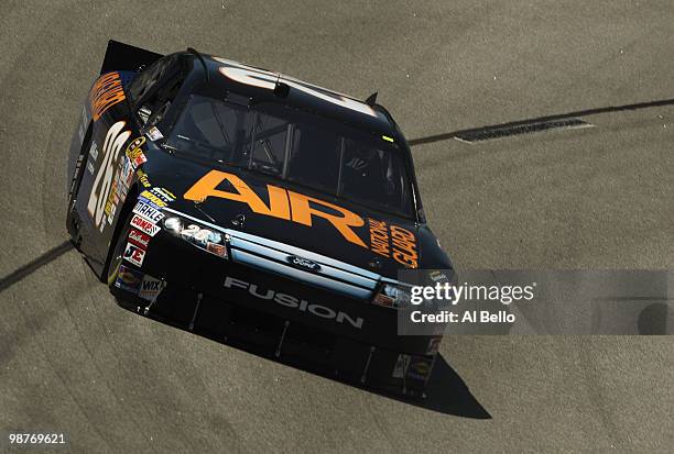 David Stremme, driver of the Air National Guard Ford, drives during practice for the Sprint Cup Series CROWN ROYAL Presents the Heath Calhoun 400 at...