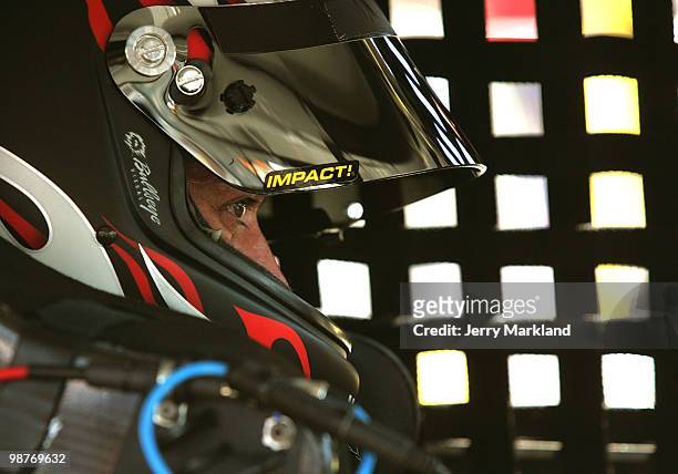 David Stremm, driver of the Air Natioinal Guard Ford, sits in his car during practice for the Sprint Cup Series CROWN ROYAL Presents the Heath...