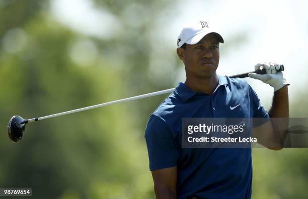 Tiger Woods reacts to a poor tee shot on the 9th hole during the second round of the Quail Hollow Championship at Quail Hollow Country Club on April...