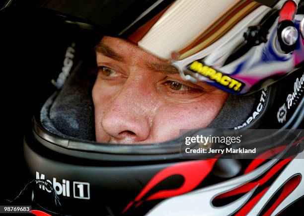 David Stremme, driver of the Air Natioinal Guard Ford, sits in his car during practice for the NASCAR Sprint Cup Series CROWN ROYAL Presents the...