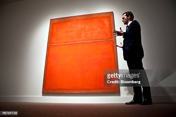 Tobias Meyer, worldwide head of contemporary art at Sotheby's, describes Mark Rothko's "untitled", during a press preview at Sotheby's in New York,...