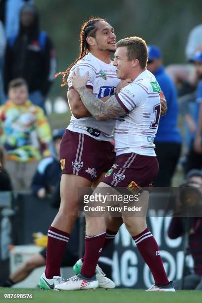 Trent Hodkinson and Martin Taupau of the Sea Eagles celebrate a try during the round 16 NRL match between the Penrith Panthers and the Manly Sea...