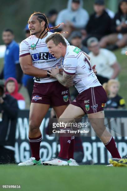 Trent Hodkinson and Martin Taupau of the Sea Eagles celebrate a try during the round 16 NRL match between the Penrith Panthers and the Manly Sea...