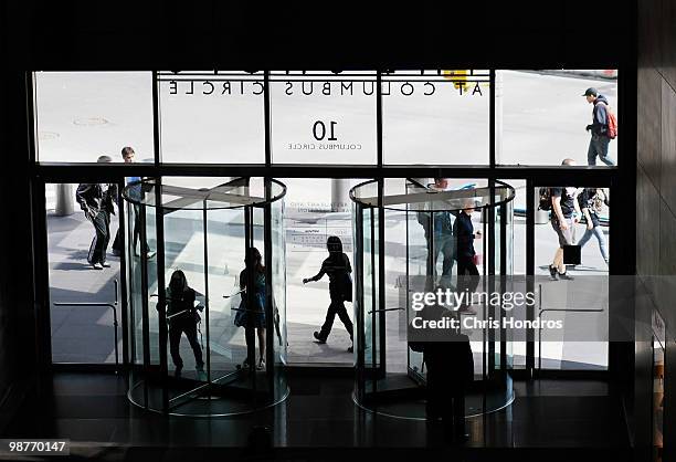 People enter and exit The Shops at Columbus Circle, an upscale mall, April 30, 2010 in New York, New York. The US economy grew 3.2% in the first...
