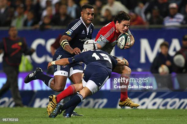 Crusaders wing Zac Guildford attempts to hand off Stormers fullback Gio Aplon's attempted tackle, as Stormers wing Sireli Naqelevuki looks on during...