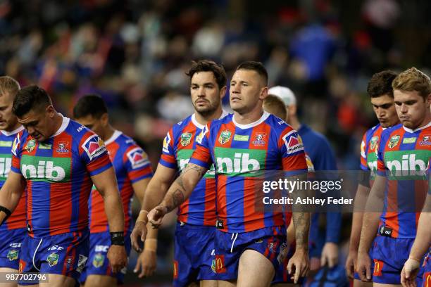 Shaun Kenny-Dowall of the Knights walks off the ground with his team during the round 10 NRL match between the Newcastle Knights and the Penrith...