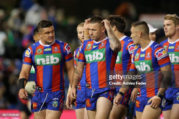 Shaun Kenny-Dowall of the Knights walks off the ground with his team during the round 10 NRL match between the Newcastle Knights and the Penrith...