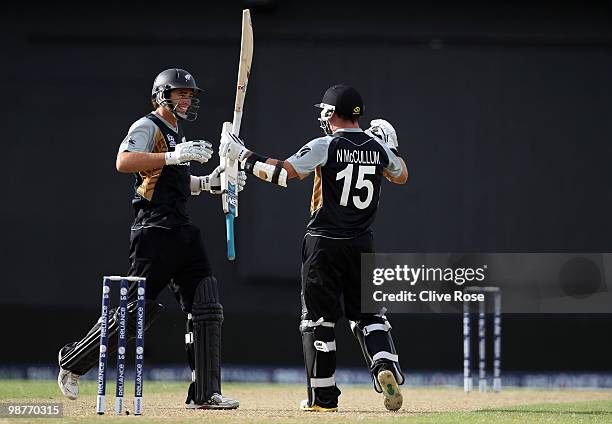 Nathan McCullum of New Zealand celebrates with Tim Southee after hitting the winning runs in the ICC T20 World Cup Group B match between Sri Lanka...