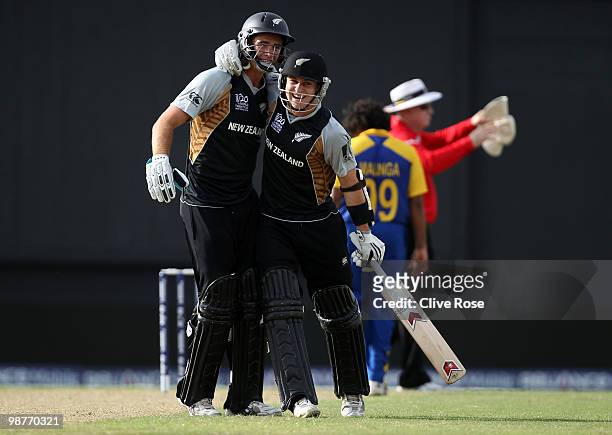 Nathan McCullum of New Zealand celebrates with Tim Southee after hitting the winning runs in the ICC T20 World Cup Group B match between Sri Lanka...