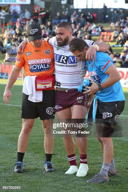 Dylan Walker of the Sea Eagles is injured during the round 16 NRL match between the Penrith Panthers and the Manly Sea Eagles at Panthers Stadium on...