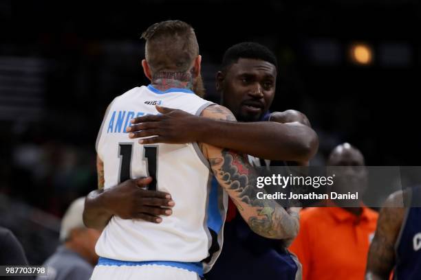 Chris Andersen of Power and Jason Maxiell of 3's Company hug after Power defeated 3's Company during week two of the BIG3 three on three basketball...