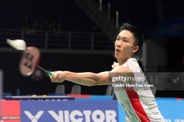 Kento Momota of Japan in action against Kidambi Srikanth of India during Celcom Axiata Badminton Malaysia Open 2018 at Bukit Jalil Stadium, Kuala...