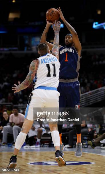 DerMarr Johnson of 3's Company shoots against Chris Andersen of Power during week two of the BIG3 three on three basketball league at United Center...
